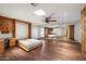 Open bedroom boasts hardwood floors, murphy bed, and built-in vanity at 4744 E Foothill Dr, Paradise Valley, AZ 85253
