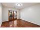 Bright bedroom features wood floors, white walls and double doors to exterior at 4744 E Foothill Dr, Paradise Valley, AZ 85253