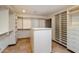 Walk-in closet featuring built-in shelving and drawers, tile flooring, and recessed lighting at 4744 E Foothill Dr, Paradise Valley, AZ 85253