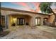 Covered entrance with stone details, custom iron door, and desert landscaping at 4744 E Foothill Dr, Paradise Valley, AZ 85253