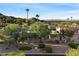 A beautiful home featuring mature trees and landscaping, situated at the base of a mountain at 4744 E Foothill Dr, Paradise Valley, AZ 85253
