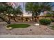 Charming exterior of a single-story home with desert landscaping and rock features at 4744 E Foothill Dr, Paradise Valley, AZ 85253