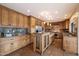 Gourmet kitchen with custom wood cabinets, granite countertops, and stainless steel appliances at 4744 E Foothill Dr, Paradise Valley, AZ 85253