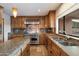 Modern kitchen with stainless steel appliances, custom cabinets, and granite countertops at 4744 E Foothill Dr, Paradise Valley, AZ 85253