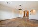 Spacious living room with travertine flooring and an arched doorway to the entryway at 4744 E Foothill Dr, Paradise Valley, AZ 85253