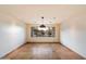 Open living room with travertine floors and large windows overlooking the backyard at 4744 E Foothill Dr, Paradise Valley, AZ 85253