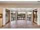 Sun Room featuring tile flooring, bay windows with views of pool and landscaping, and lots of natural light at 4744 E Foothill Dr, Paradise Valley, AZ 85253