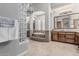 Stunning primary bathroom featuring tile flooring, an elegant chandelier and a luxurious soaking tub at 5291 S Bradshaw Pl, Chandler, AZ 85249