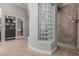 Tiled shower with a glass block window, creating a bright and open feel in the bathroom at 5291 S Bradshaw Pl, Chandler, AZ 85249