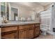 Bathroom featuring a spacious vanity with stylish tile backsplash and neutral-toned shower curtain at 5291 S Bradshaw Pl, Chandler, AZ 85249