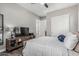 Bright bedroom with a TV and an adjacent bathroom, offering convenient ensuite amenities at 5291 S Bradshaw Pl, Chandler, AZ 85249