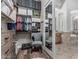 Organized walk-in closet with built-in shelving and clothing racks, adjacent to the bathroom at 5291 S Bradshaw Pl, Chandler, AZ 85249