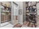 Spacious closet with organized shelves and racks, leading into a bright bathroom at 5291 S Bradshaw Pl, Chandler, AZ 85249