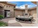 Relaxing outdoor courtyard featuring comfortable seating, a fireplace, and stylish desert landscaping at 5291 S Bradshaw Pl, Chandler, AZ 85249