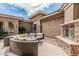 Charming courtyard with outdoor seating, fireplace, and lush desert landscaping for private outdoor living at 5291 S Bradshaw Pl, Chandler, AZ 85249