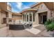 Picturesque courtyard with curved seating, fireplace, and multiple windows creating a private outdoor retreat at 5291 S Bradshaw Pl, Chandler, AZ 85249