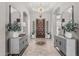 Grand foyer with decorative tile flooring, arched doorways, designer lighting, and stylish furnishings at 5291 S Bradshaw Pl, Chandler, AZ 85249