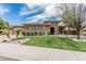 Beautiful front yard featuring a manicured lawn, desert landscaping, and a charming, modern exterior at 5291 S Bradshaw Pl, Chandler, AZ 85249