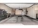 Spacious three car garage with storage cabinets, epoxy floors and ample space for vehicles and projects at 5291 S Bradshaw Pl, Chandler, AZ 85249