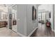 Hallway view of a bathroom and a seating area with abundant natural light at 5291 S Bradshaw Pl, Chandler, AZ 85249