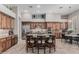 Spacious kitchen featuring an island with barstool seating, stainless steel appliances, and wood cabinetry at 5291 S Bradshaw Pl, Chandler, AZ 85249