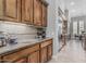 Ample counter space and storage featuring granite counters and custom cabinetry at 5291 S Bradshaw Pl, Chandler, AZ 85249