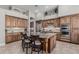 Spacious kitchen island with granite countertops and breakfast bar seating at 5291 S Bradshaw Pl, Chandler, AZ 85249