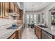 Beautiful kitchen features stainless steel appliances, granite countertops and adjacent breakfast nook at 5291 S Bradshaw Pl, Chandler, AZ 85249