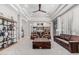 Spacious living room with coffered ceilings, comfortable leather seating, and an open view into the kitchen at 5291 S Bradshaw Pl, Chandler, AZ 85249