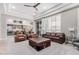 Comfortable living room featuring ample seating, a ceiling fan, and a view into the adjacent kitchen area at 5291 S Bradshaw Pl, Chandler, AZ 85249