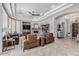 An inviting living room with stone fireplace, comfortable seating and a view of dining area at 5291 S Bradshaw Pl, Chandler, AZ 85249