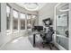 Bright home office featuring large windows, modern lighting, and stylish desk setup, creating a productive workspace at 5291 S Bradshaw Pl, Chandler, AZ 85249