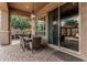 Charming covered patio featuring comfortable seating, perfect for enjoying outdoor meals and garden views at 5291 S Bradshaw Pl, Chandler, AZ 85249
