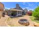 The backyard features a cozy fire pit, perfect for outdoor gatherings and enjoying the evening ambiance at 6320 W Mercer Ln, Glendale, AZ 85304
