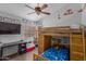 bedroom with a fun bunk bed, artwork, and a television for entertainment at 6320 W Mercer Ln, Glendale, AZ 85304