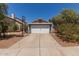 Charming home with a gray exterior, a two-car garage, and a basketball hoop in the driveway at 6320 W Mercer Ln, Glendale, AZ 85304