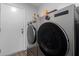 Modern laundry room equipped with updated washer and dryer at 6320 W Mercer Ln, Glendale, AZ 85304