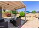 A covered patio offers a comfortable outdoor living space, ideal for entertaining guests at 6320 W Mercer Ln, Glendale, AZ 85304