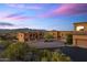 Stunning desert homes showcasing the neighborhood's circular driveways and mountain views at twilight at 7199 E Ridgeview Pl # 221, Carefree, AZ 85377