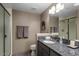 Elegant bathroom features granite countertop, framed mirror and shower with glass door at 7199 E Ridgeview Pl # 221, Carefree, AZ 85377