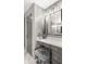 Bathroom vanity with grey cabinets, makeup mirror, and a fur stool at 7199 E Ridgeview Pl # 221, Carefree, AZ 85377
