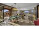 Open concept dining area leading to living room and an outside seating area with mountain views at 7199 E Ridgeview Pl # 221, Carefree, AZ 85377