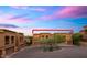 Close exterior view of homes showcases classic architecture with a backdrop of mountains and a colorful sky at 7199 E Ridgeview Pl # 221, Carefree, AZ 85377