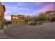 Beautiful multi-story house with multiple garage doors and well-maintained desert landscaping at 7199 E Ridgeview Pl # 221, Carefree, AZ 85377