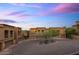 Gorgeous community featuring desert landscaping and multiple garages with beautiful sunset sky at 7199 E Ridgeview Pl # 221, Carefree, AZ 85377