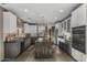 Modern kitchen with white cabinets, granite countertops, and stainless steel appliances at 7199 E Ridgeview Pl # 221, Carefree, AZ 85377