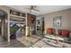 Inviting living room with fireplace, built-in shelves, and stylish decor at 7199 E Ridgeview Pl # 221, Carefree, AZ 85377