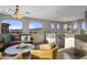 Bright living room featuring arched windows with mountain views, comfortable seating and stylish decor at 7199 E Ridgeview Pl # 221, Carefree, AZ 85377