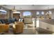 Comfortable living area with mountain views through expansive arched windows and inviting seating at 7199 E Ridgeview Pl # 221, Carefree, AZ 85377