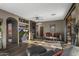 Inviting living room with a fireplace, built-in shelves, and a sliding glass door to the outdoors at 7199 E Ridgeview Pl # 221, Carefree, AZ 85377